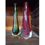 Four glass vases {20 cm H, 19 cm H, 16 cm H and 14 cm H}.