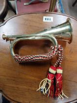 Brass bugle. {19 cm H x 30 cm W}.