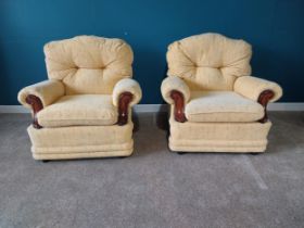 Pair of upholstered armchairs{93 cm H 94 cm W 72cm D}.