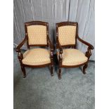Pair of Regency carved mahogany and upholstered arm chairs.