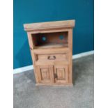 Stripped pine side cabinet with single drawer in frieze over blind door. {92 cm H x 59 cm W x 41