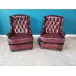 Pair of deep buttoned leather and mahogany wingback armchairs {93 cm H 68 cm W 74cm D}.