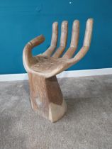 Carved hardwood stool in the form of a Hand. {75 cm H x 42 cm W x 45 cm D}.{ cm H cm W cm D}.