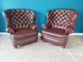 Pair of deep buttoned leather wingback armchairs{109 cm H 98 cm W 76cm D}.