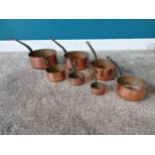 Set of seven early 20th C. graduated copper saucepans with metal handles {9 cm H x 7 cm W x 14 cm