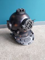 Copperised metal divers helmet {40 cm H x 32 cm W x 43 cm D}.