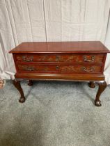 Decorative mahogany side chest with two drawers raised on carved cariole legs and ball & claw feet