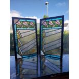 Pair of Art Deco stained glass panels mounted in oak frames {56 cm H 35 cm W cm D}.