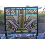 Art Deco stained glass panel mounted in oak frame {57 cm H 66 cm W cm D}.