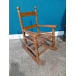 Child's pine rocking chair. {56 cm H x 37 cm W X 46 cm D}.{ cm H cm W cm D}.