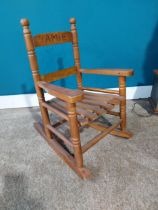 Child's pine rocking chair. {56 cm H x 37 cm W X 46 cm D}.{ cm H cm W cm D}.
