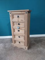 Stripped pine tallboy with five drawers. {104 cm H x 53 cm W x 40 cm D}.{ cm H cm W cm D}.