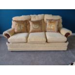 Upholstered three seater sofa {83 cm H 176 cm W 75cm D}.