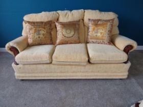 Upholstered three seater sofa {83 cm H 176 cm W 75cm D}.