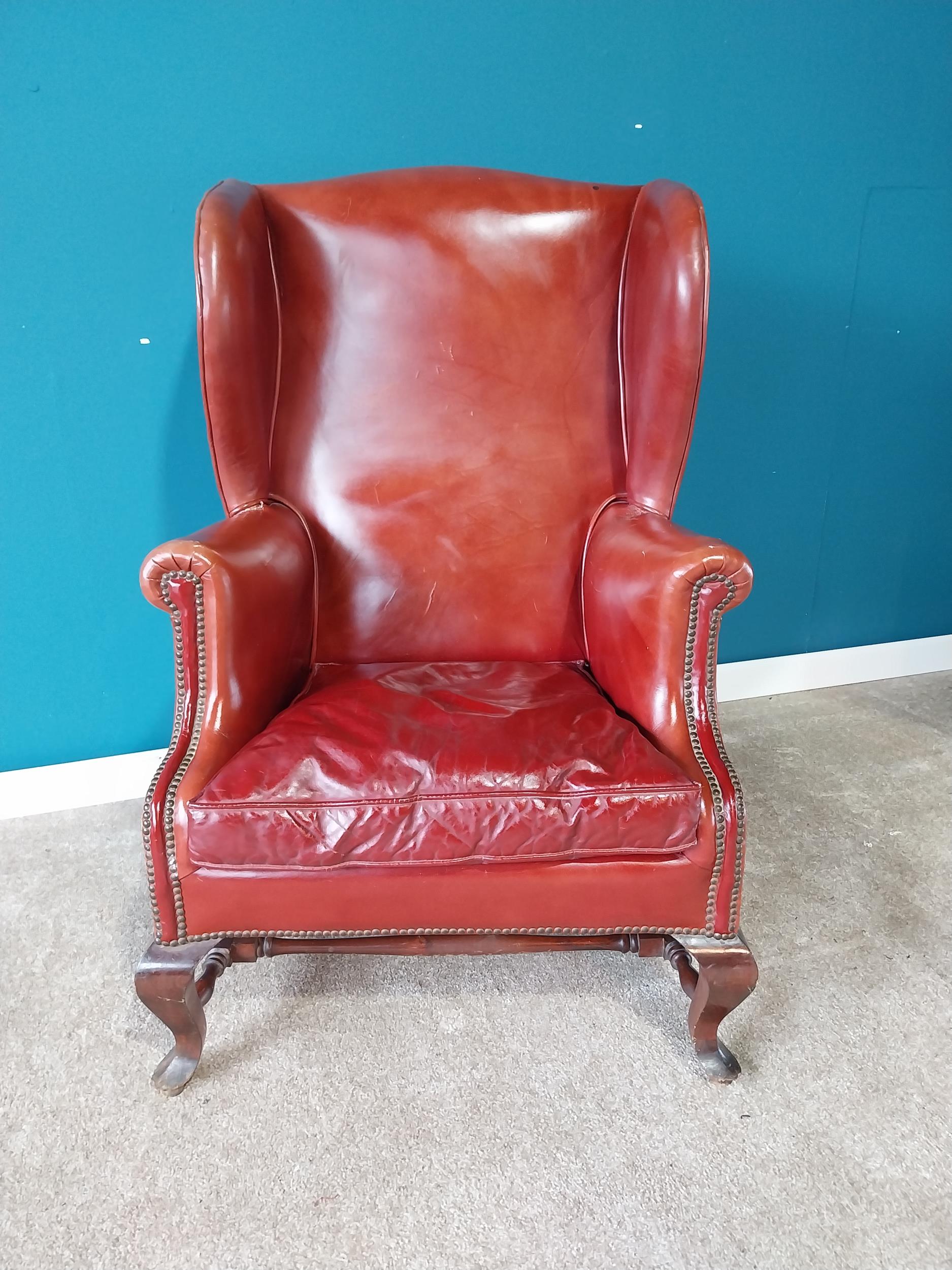 Leather wingback armchair raised on mahogany cabriole legs {114 cm H 77 cm W 67cm D}. - Image 2 of 4