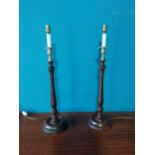 Pair of good quality mahogany and brass tables lamps {66 cm H 18 cm W 18cm D}.