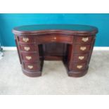 Mahogany kidney shaped desk with inset leather top with single long drawer flanked by eight short