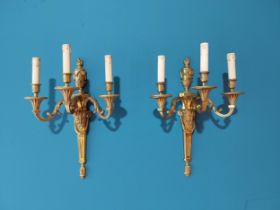 Pair of exceptional quality gilded bronze three branch wall sconces in the Empire style {52 cm H x