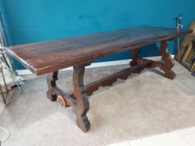 Good quality stained pine Spanish refectory table on lyre supports on single stretcher. {77 cm H x