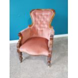 William IV carved mahogany and upholstered arm chair raised on turned legs and castors {98 cm H 70