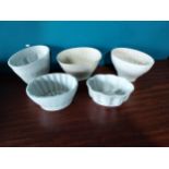 Collection of five early 20th C. ceramic jelly moulds{ cm H cm W cm D}.