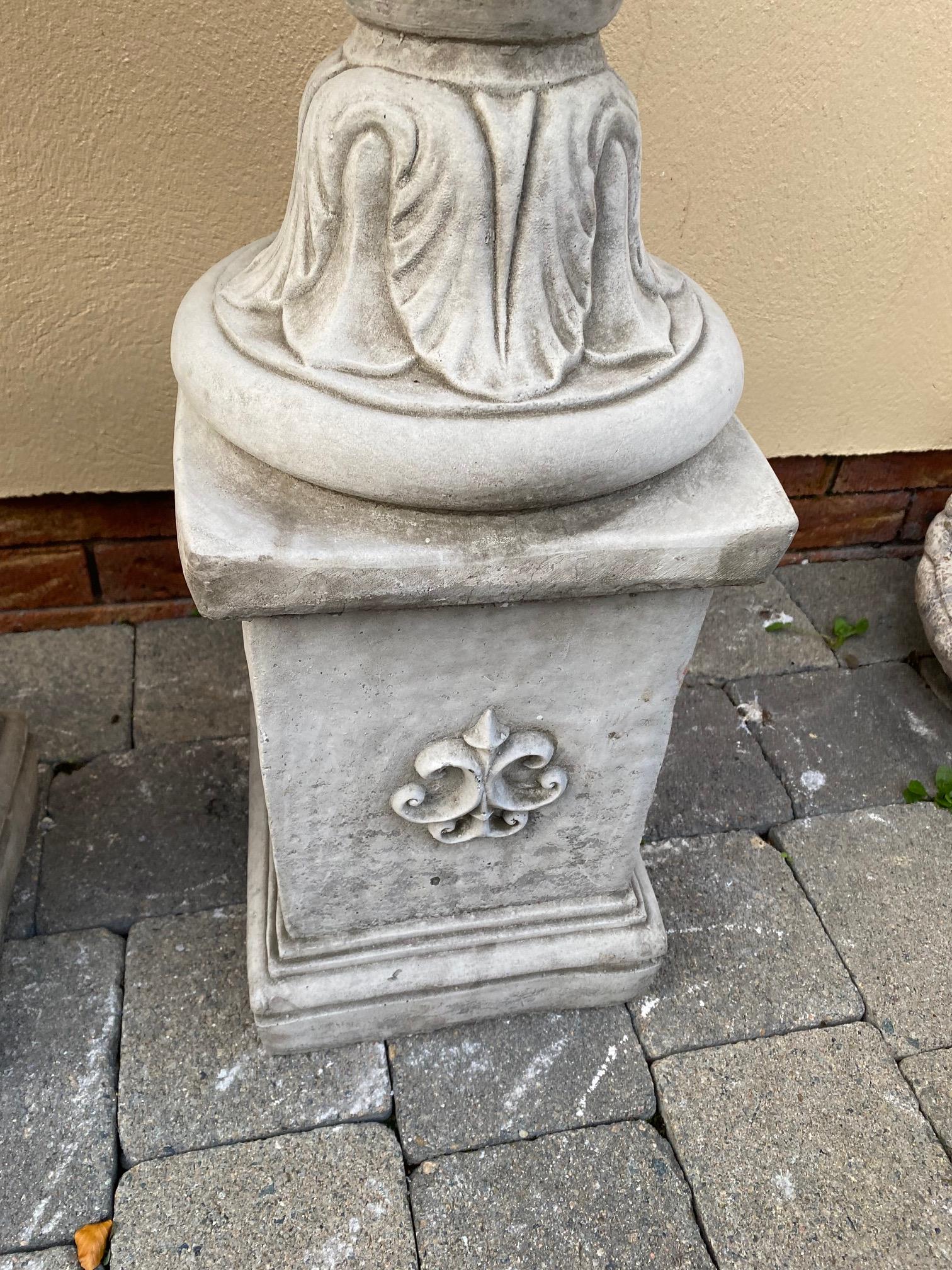 Pair of stone urns with leaf decoration on square pedestal bases. {96 cm H x 41 cm Dia.}. - Image 5 of 5