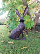 Exceptional quality bronze sculpture of a hare { 61cm H x 36cm W x 19cm D}