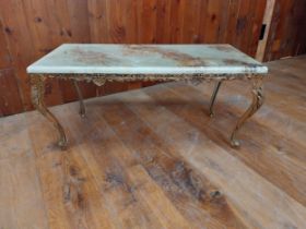Decorative gilded metal coffee table with marbleised top