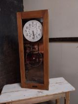 1950s International clock in clock out in pine case {110 cm H x 42 cm W x 21 cm D}.