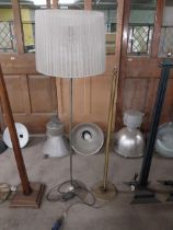 Brass standard lamp {130 cm H} and chrome standard lamp with cloth shade {163 cm H}.