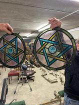 Pair of circular stained glass panels with star motif {34 cm Dia.}.