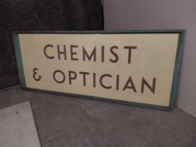 Early 20th C. glass Chemist & Opticians sign mounted in pine frame.