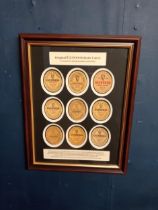 Guinness bottle advertising labels mounted in frame {H 46cm x W 36cm }.