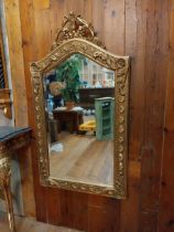 Decorative gilt wall mirror in the Victorian style {115 cm H x 64 cm W}.