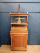 Oak book press over cabinet with single blind door {H 156cm x W 66cm x D 44cm }.