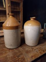 Two early 20th C. glazed stoneware Whiskey flagons {40 cm H x 23 cm Dia. And 41 cm H x 22 cm Dia.}.