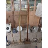 Brass standard lamp {140 cm H} and mahogany standard lamp {166 cm H}.