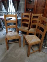 Set of four vintage pine Kitchen chairs with rattan seats {107 cm H x 46 cm W x48 cm D}.