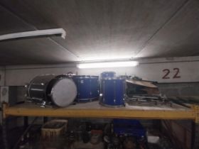 Contents of one shelf (drums and lights).