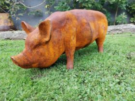 Good quality large cast iron model of a pig {34cm H x 65cm W x 24cm D}