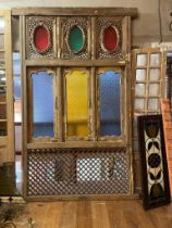 Decorative wooden divider with coloured frosted glass panels and metal gridding {257cm H x 158cm W}