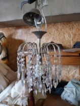 Decorative polished metal and glass chandelier {62 cm H x 23 cm W x 23 cm D}.