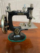 Unusual small cast iron Singer sewing machine.