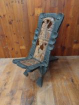 Carved wooden African birthing chair