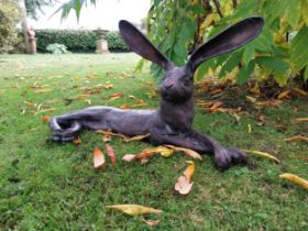 Exceptional quality bronze sculpture of a hare lying down { 32cm H x 61cm W x 24cm D}