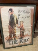 Charlie Chaplin in The Kid movie poster mounted in wooden frame {100 cm H x 76 cm W }.