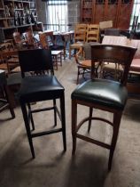 Two vintage stained pine bar stools with upholstered seats {Approx. 114 cm H x 47 cm W x47 cm D}.