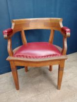 Oak desk chair with red leather upholstered seat and arms {H 75cm x W 58cm x D 52cm }.
