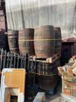 Collection of four wooden and metal bound whiskey barrels {88cm H x 70cm Dia}
