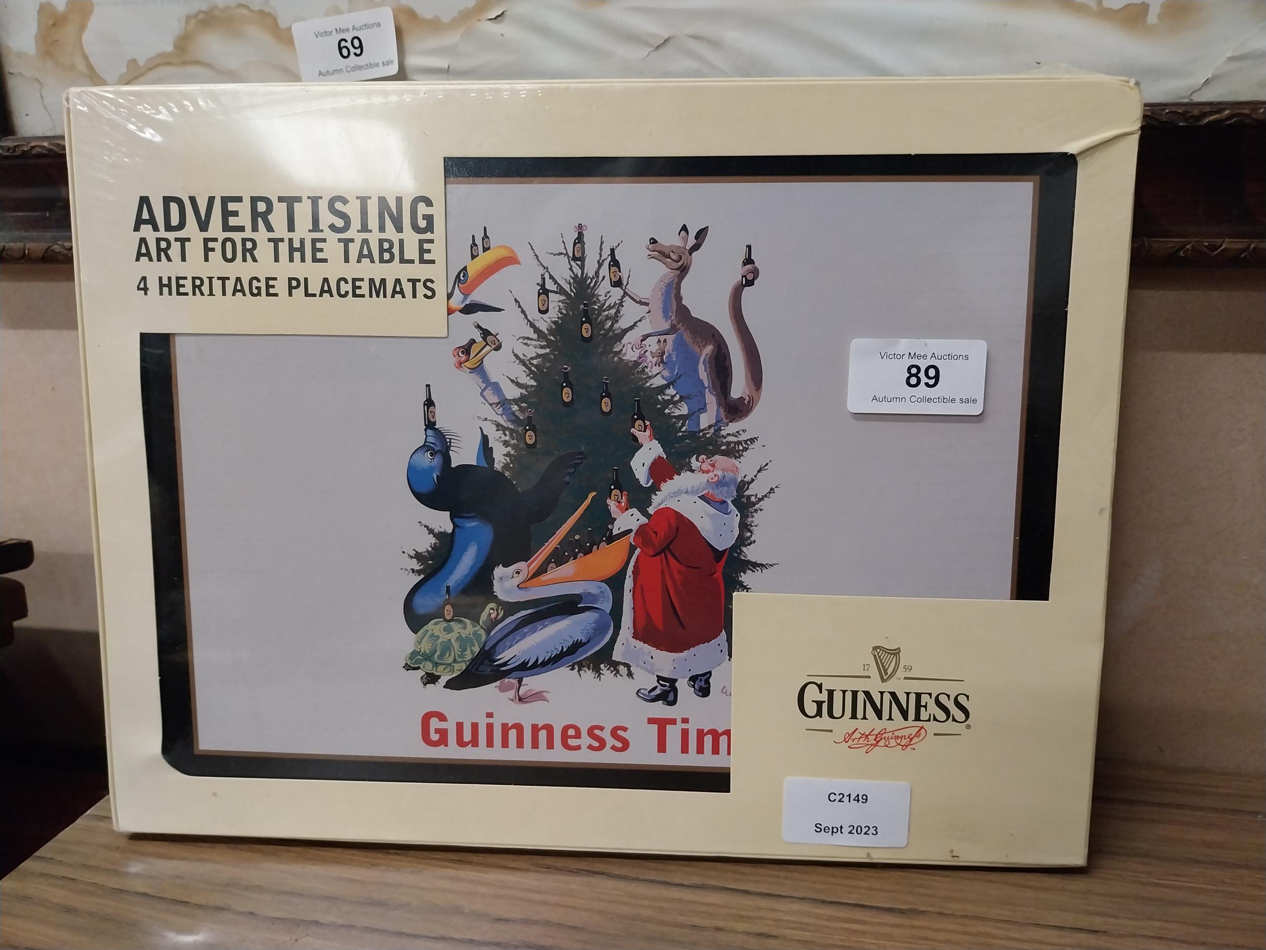 Four Guinness Heritage placemats. {23 cm H x 31 cm W}